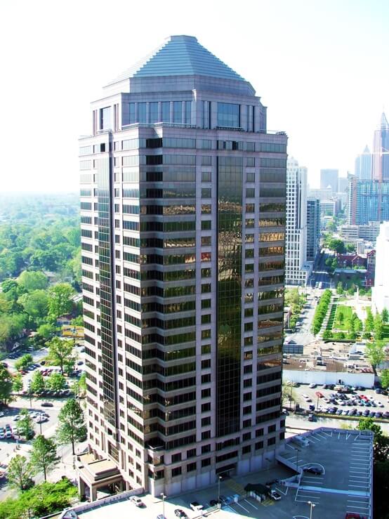 1100 Peachtree office building in Atlanta, GA after all exterior glass, metal and stone was restored and protected by Presto Restoration