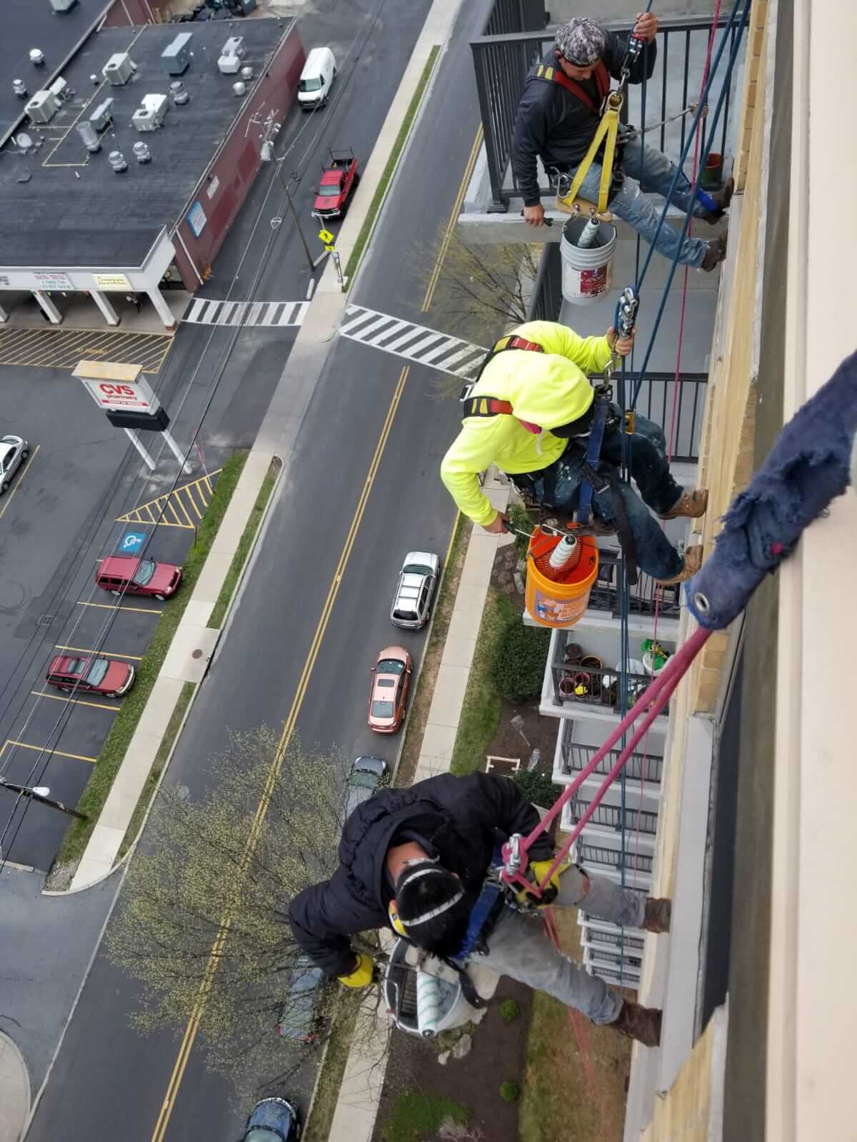 Presto waterproofing technicians rappelling off of B’nai B’rith Apartments, Allentown, PA