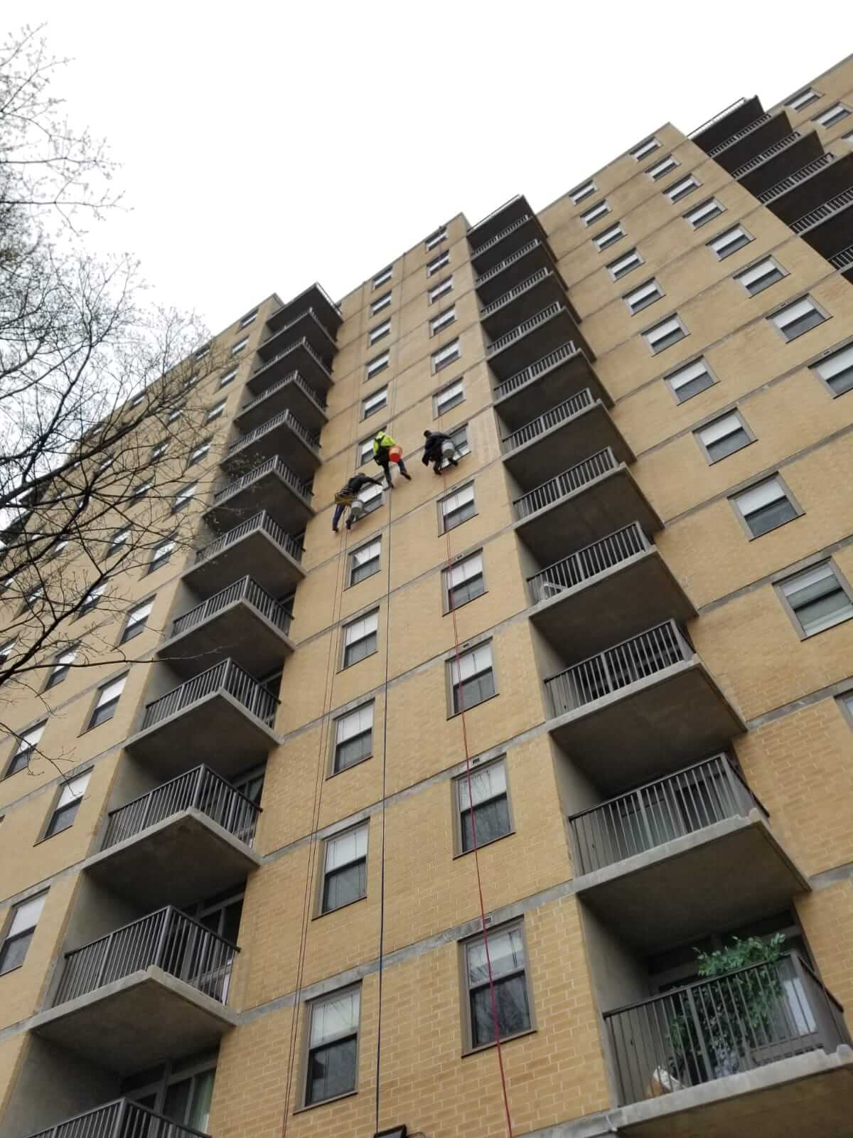 Presto waterproofing technicians rappelling off of B’nai B’rith Apartments, Allentown, PA