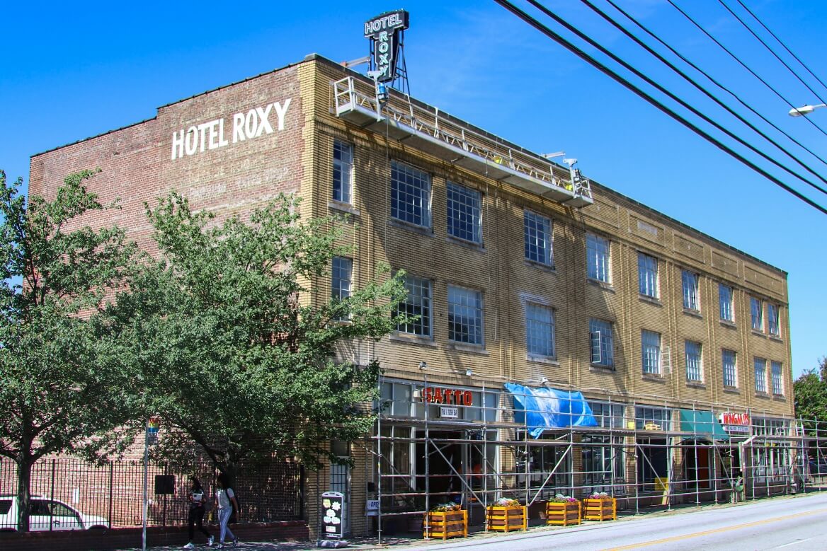 Swing stage on historic loft building in Atlanta for performing restoration and waterproofing on the facade