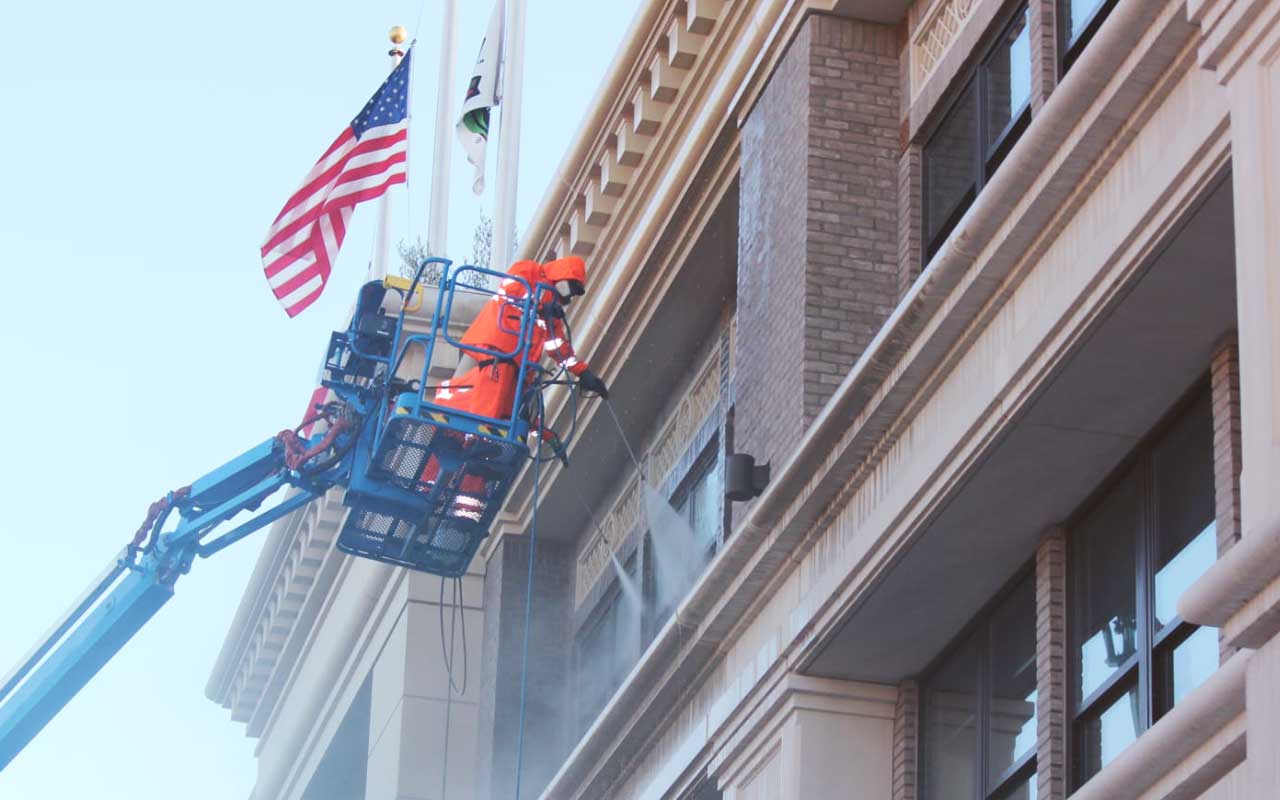 Commercial Building Restoration Contractors Cleaning a Building in California