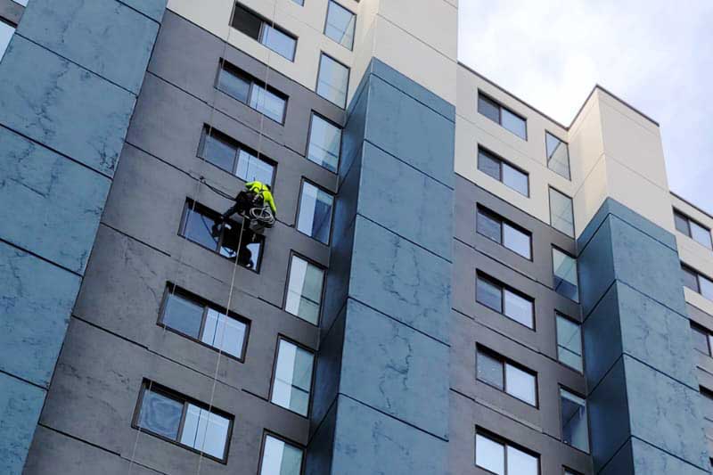 commercial waterproofing professional working on memphis apartment building